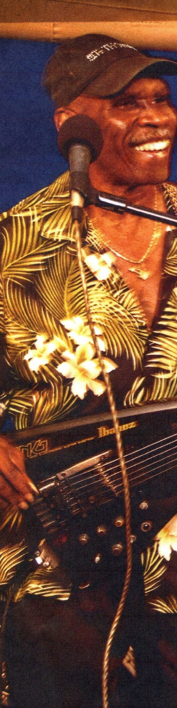 Sammy Watts on stage with his guitar